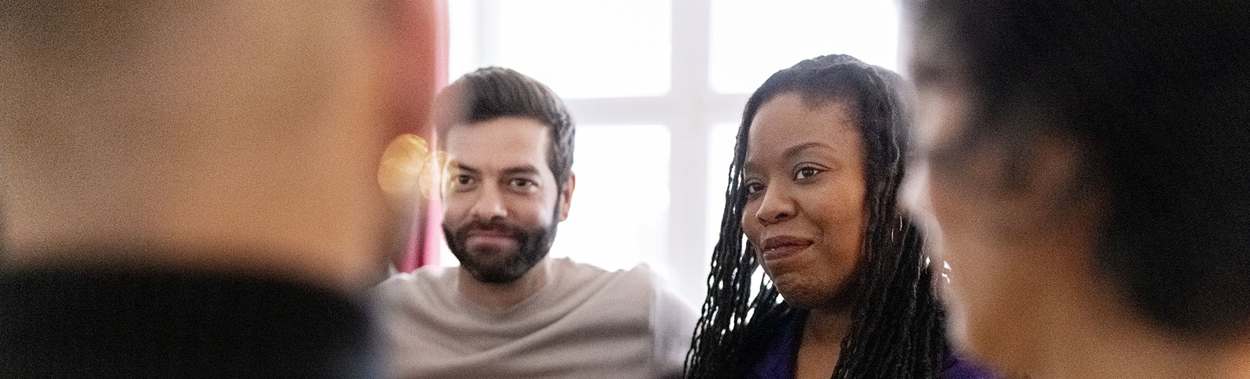 People having a conversation in a group setting
